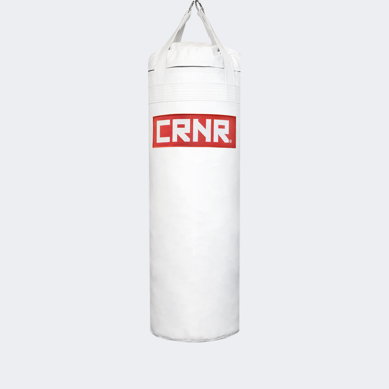Photo of the front of Combat Corner's white with red label 80 lbs. Made in the USA Punching Bag.