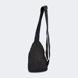 Product photo of the back of the CRNR Sling Bag by Combat Corner showing the bag's extended carrying strap