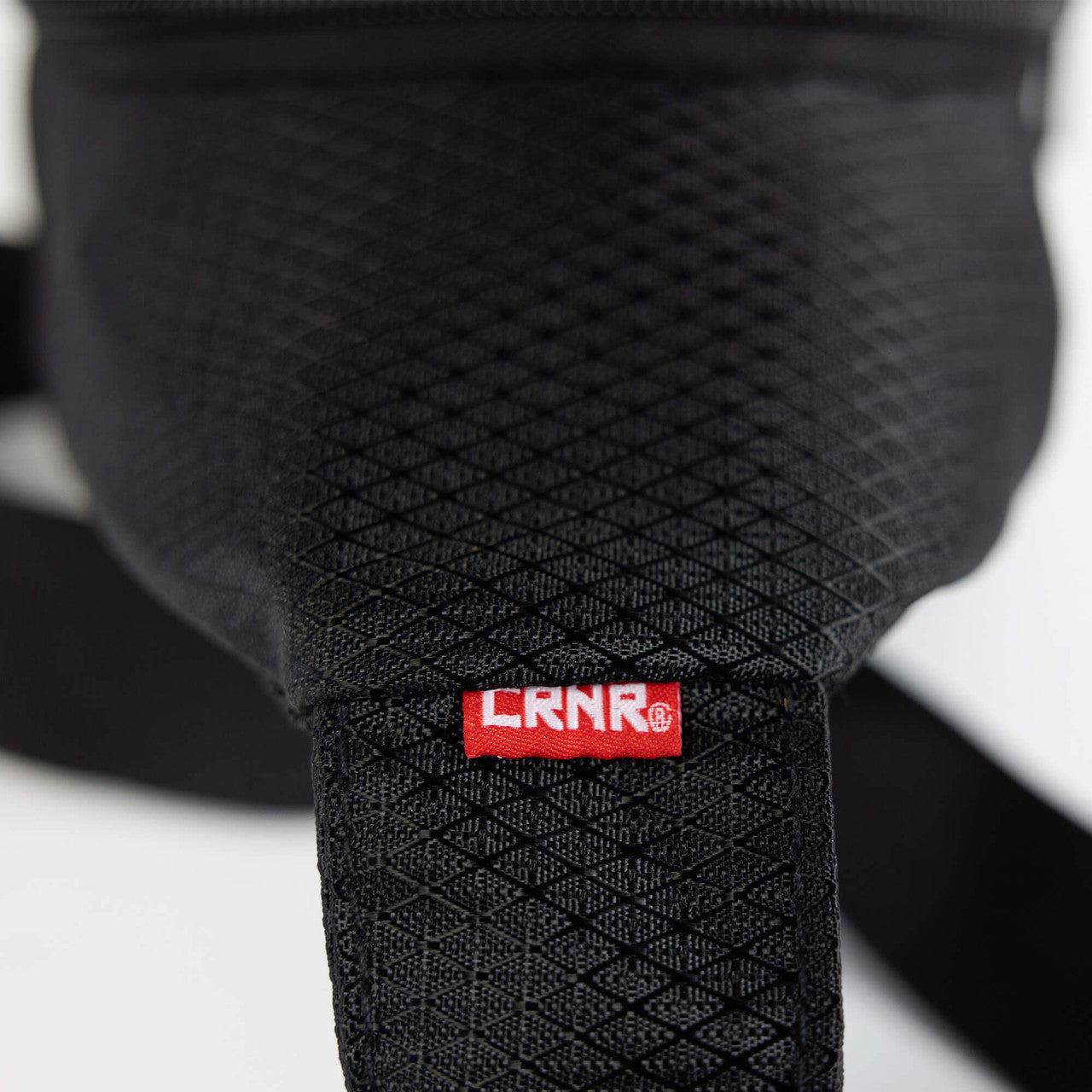 Closeup detail product photo of the premium carrying straps on the CRNR Sling Bag by Combat Corner