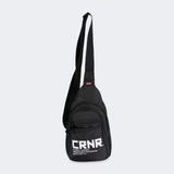 Product photo of the front of the CRNR Sling Bag by Combat Corner showing the bag's extended carrying strap