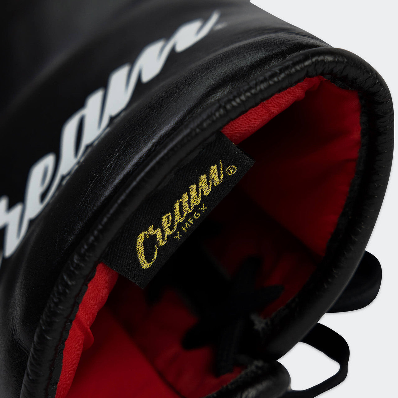 Close up detail photo of the inner scarlet lining of Combat Corner's black Cream TM1 Competition Boxing Gloves, which are Japanese inspired Mexican Boxing Gloves that are hand made in Thailand.