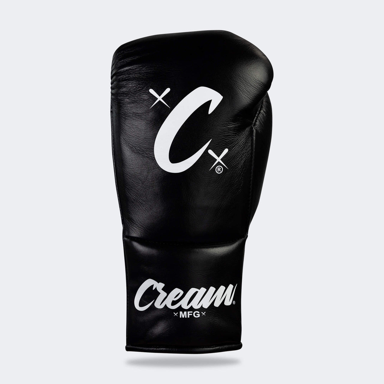 Photo of the top side of Combat Corner's black Cream TM1 Competition Boxing Gloves, which are Japanese inspired Mexican Boxing Gloves that are hand made in Thailand.