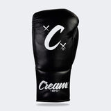 Photo of the top side of Combat Corner's black Cream TM1 Competition Boxing Gloves, which are Japanese inspired Mexican Boxing Gloves that are hand made in Thailand.