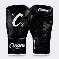 Photo of a pair of Combat Corner's black Cream TM1 Competition Boxing Gloves, which are Japanese inspired Mexican Boxing Gloves that are hand made in Thailand.