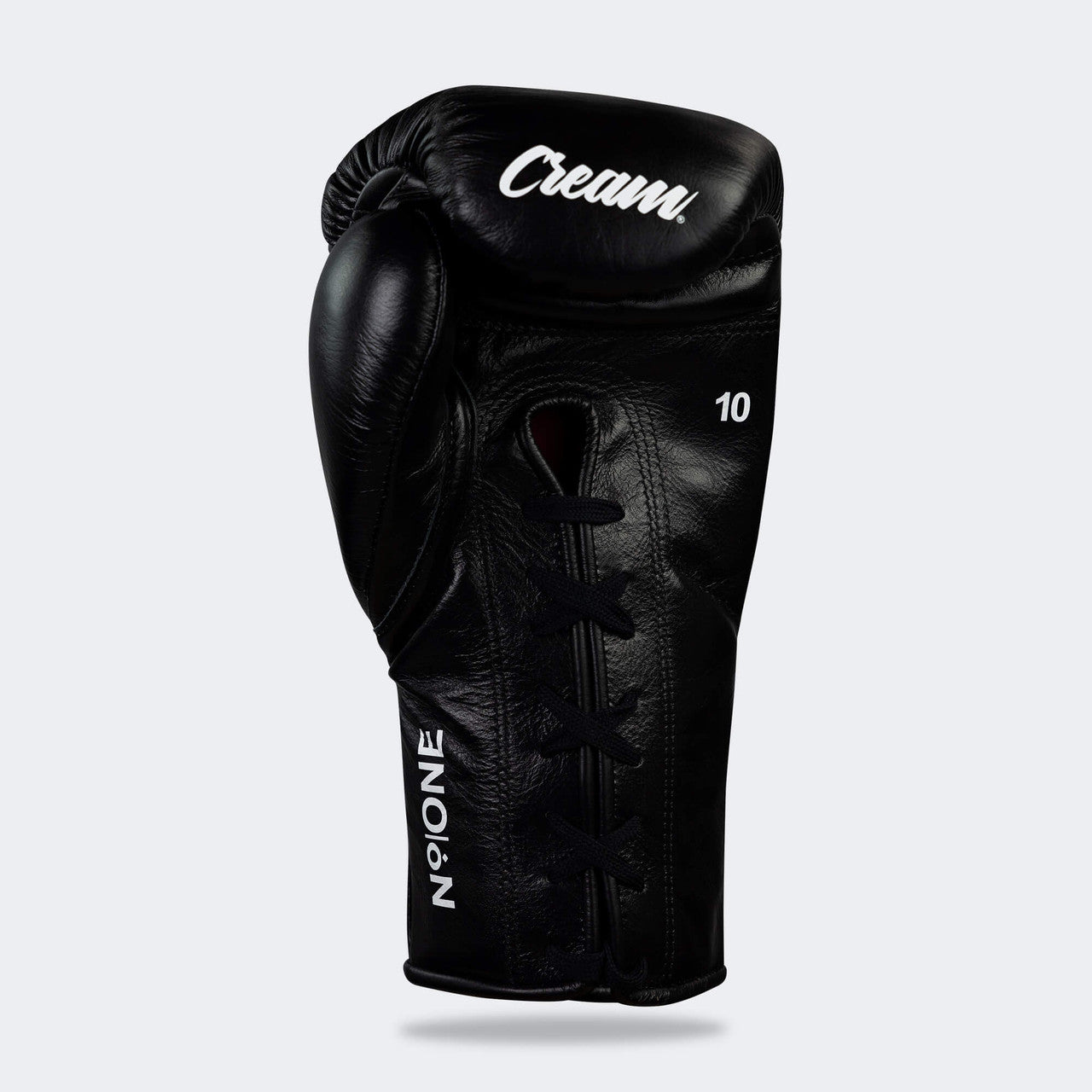 Photo of the bottom palm side of Combat Corner's black Cream TM1 Competition Boxing Gloves, which are Japanese inspired Mexican Boxing Gloves that are hand made in Thailand.