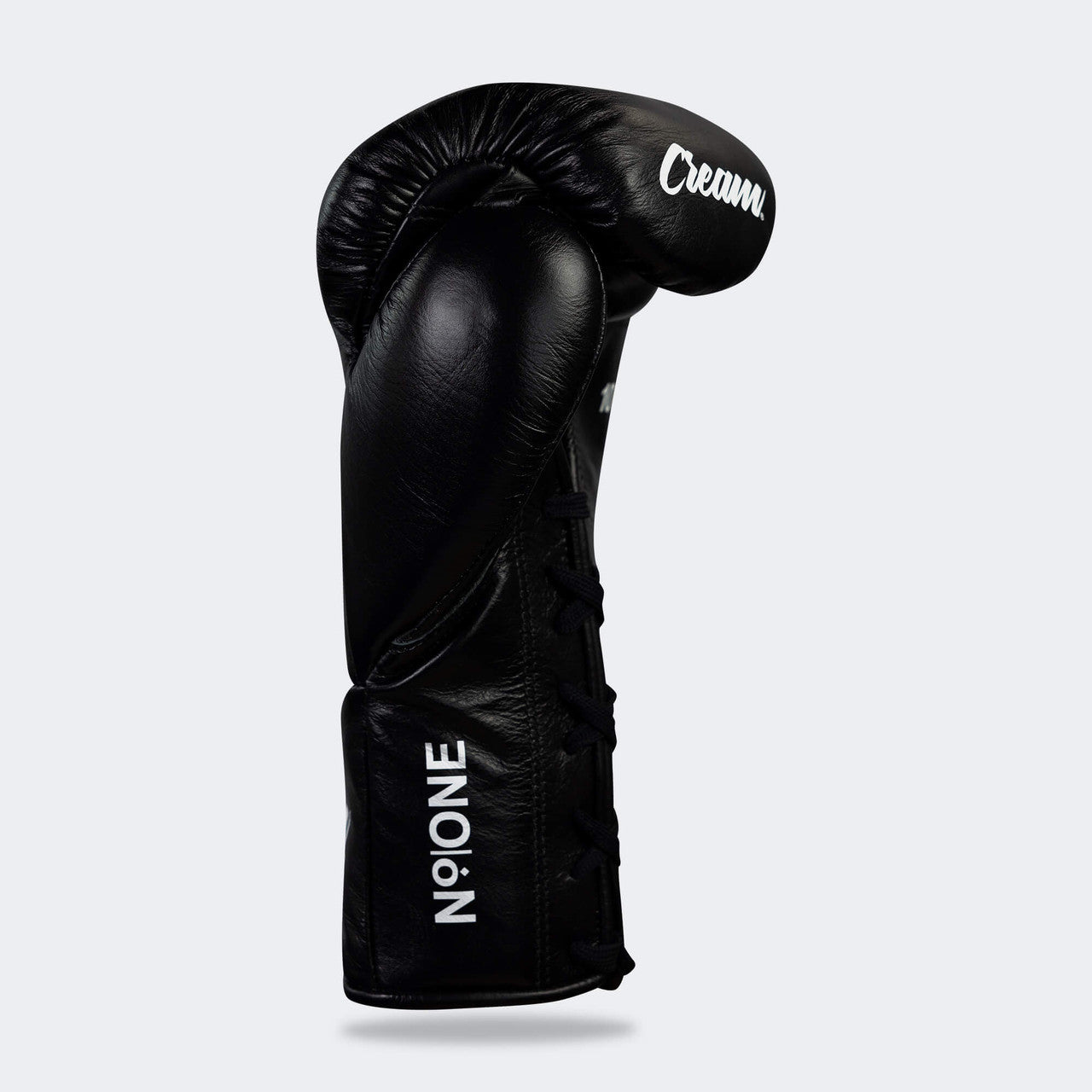 Photo of the palm right side of Combat Corner's black Cream TM1 Competition Boxing Gloves, which are Japanese inspired Mexican Boxing Gloves that are hand made in Thailand.