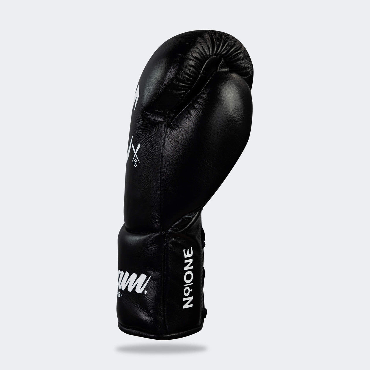 Photo of the left side of Combat Corner's black Cream TM1 Competition Boxing Gloves, which are Japanese inspired Mexican Boxing Gloves that are hand made in Thailand.