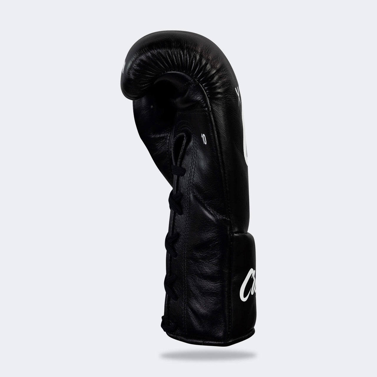 Photo of the right side of Combat Corner's black Cream TM1 Competition Boxing Gloves, which are Japanese inspired Mexican Boxing Gloves that are hand made in Thailand.