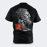 Rear studio view of a black Combat Corner HWD Ancient t-shirt, featuring a large graphic of a classical bearded statue bust in profile, accented by red "HARD WORK DEDICATION" block text.