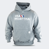 Front view of a heather gray Combat Corner USA Muay Thai lifestyle hooded sweatshirt with a kangaroo pocket, showcasing a white, red, and blue "USA MUAY THAI" graphic across the chest.