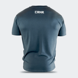 Rear view of a dark slate blue Combat Corner USA Muay Thai lifestyle crewneck t-shirt, featuring a clean white CRNR logo printed centered on the upper back just below the collar.