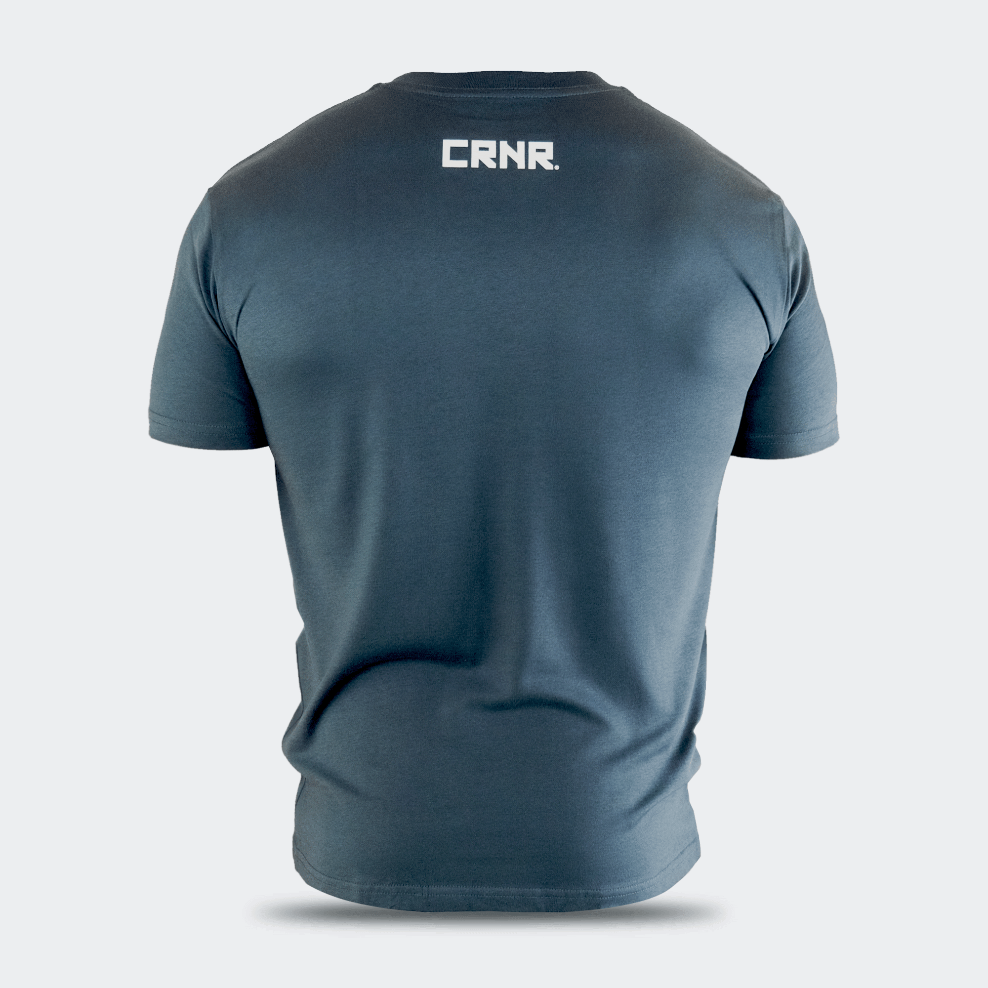 Rear view of a dark slate blue Combat Corner USA Muay Thai lifestyle crewneck t-shirt, featuring a clean white CRNR logo printed centered on the upper back just below the collar.