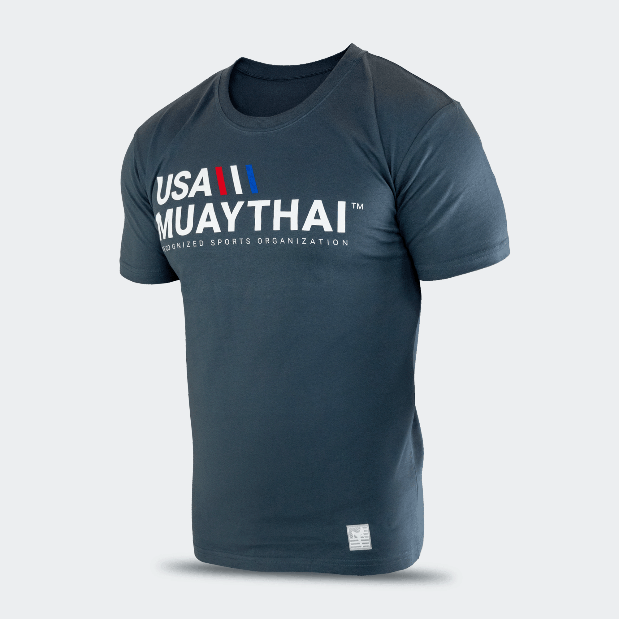 Three-quarters angled studio shot of the dark slate blue Combat Corner USA Muay Thai lifestyle tee, highlighting its modern athletic fit, crewneck collar, and clean sleeve stitching.