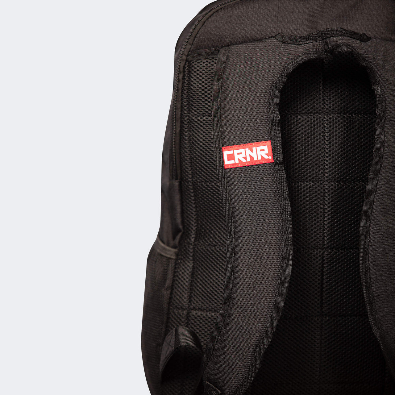 Closeup detail product photo of the deluxe shoulder straps on the black Combat Corner Vital 30 Training Backpack