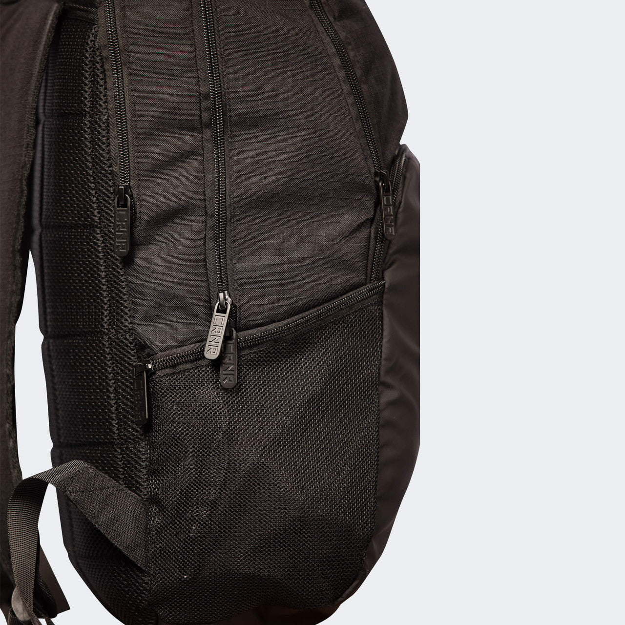 Closeup detail product photo of the deluxe zippers on the black Combat Corner Vital 30 Training Backpack
