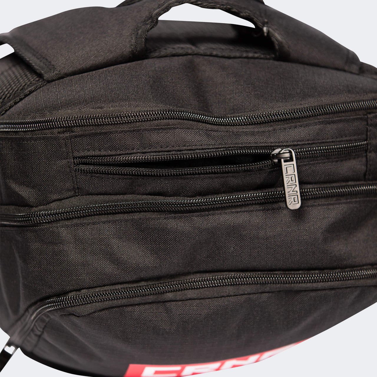 Top down closeup detail product photo of the deluxe shoulder straps on the black Combat Corner Vital 30 Training Backpack