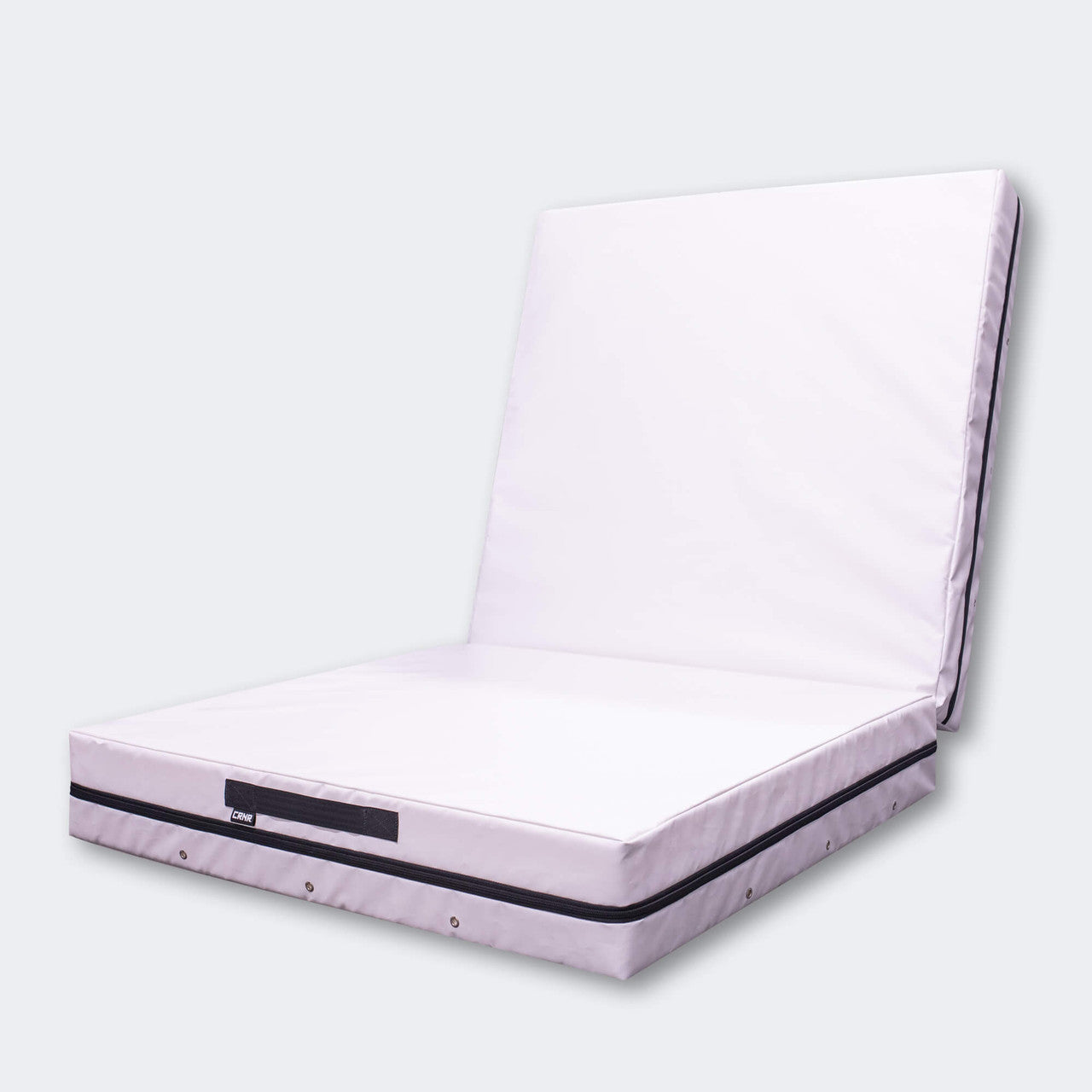 Photo of Combat Corner's white Made in the USA Crash Pad, made for MMA, Wrestling, BJJ, Judo, Martial Arts, and more, folded at right angle to cover the gym floor and wall.